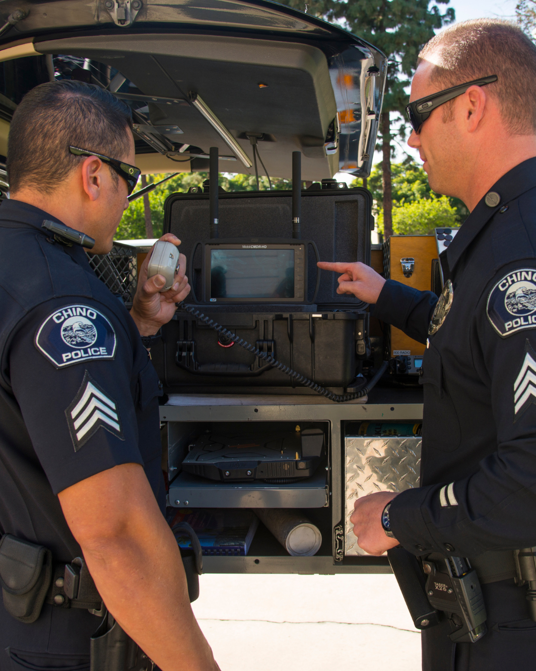 Chino Police Department looking at audio equipment